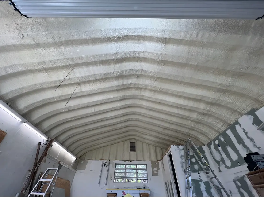 Spray polyurethane foam applied to the underside of a metal roof deck in Winthrop